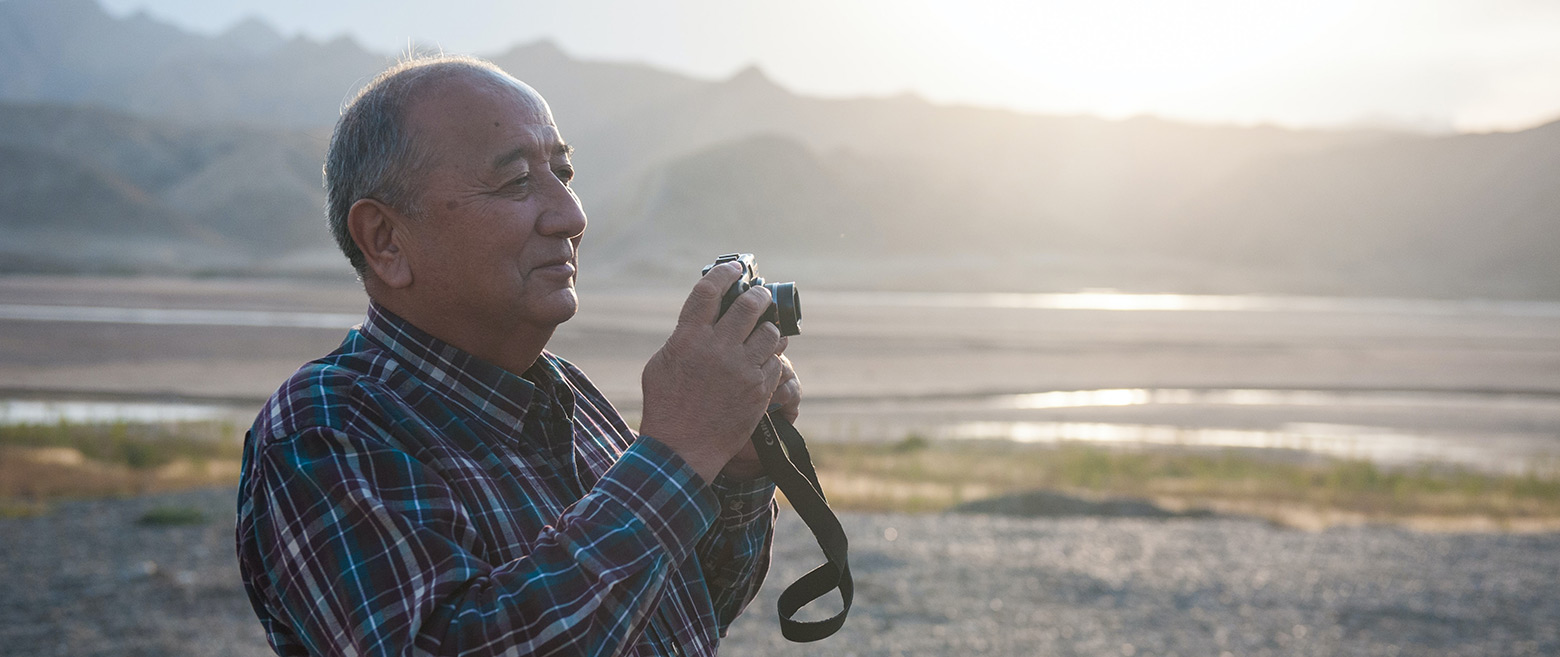 Image of a man taking a photo