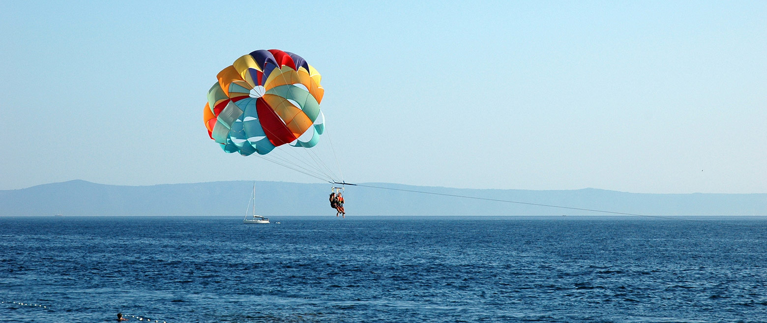 Parasailing over an ocean.