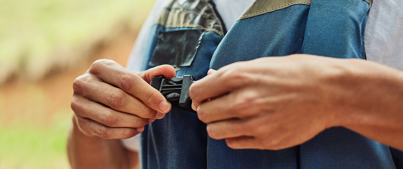 Image of someone clipping their vest 