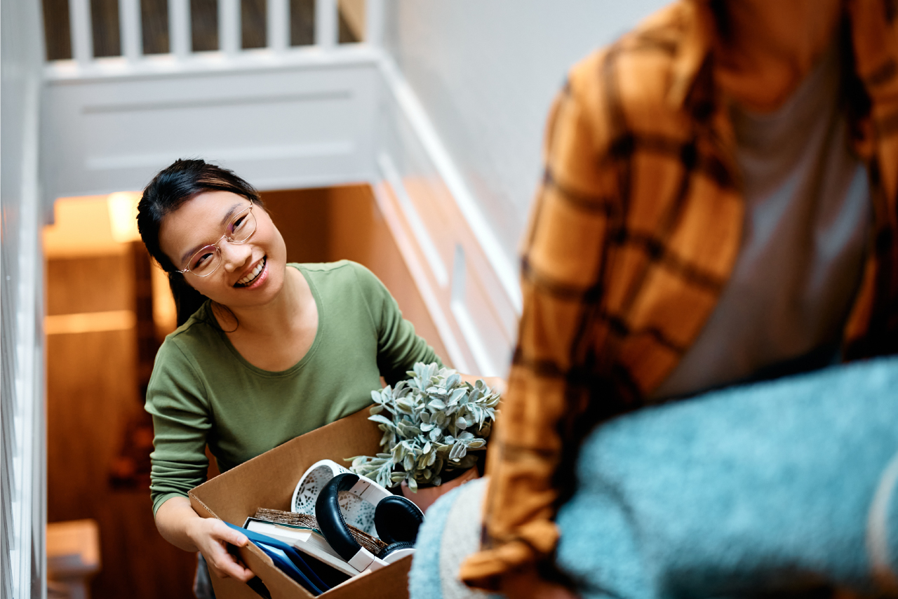 lady holding a moving box