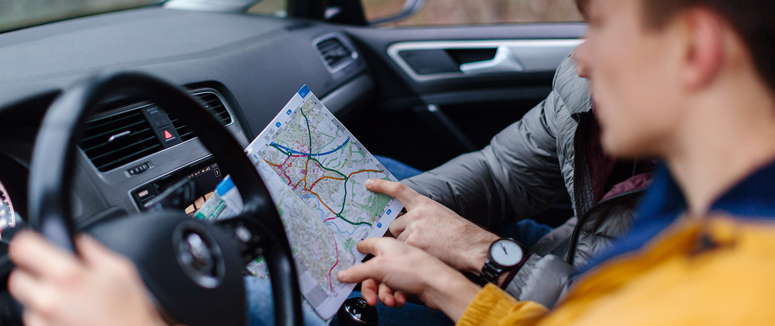 People pointing at map for directions