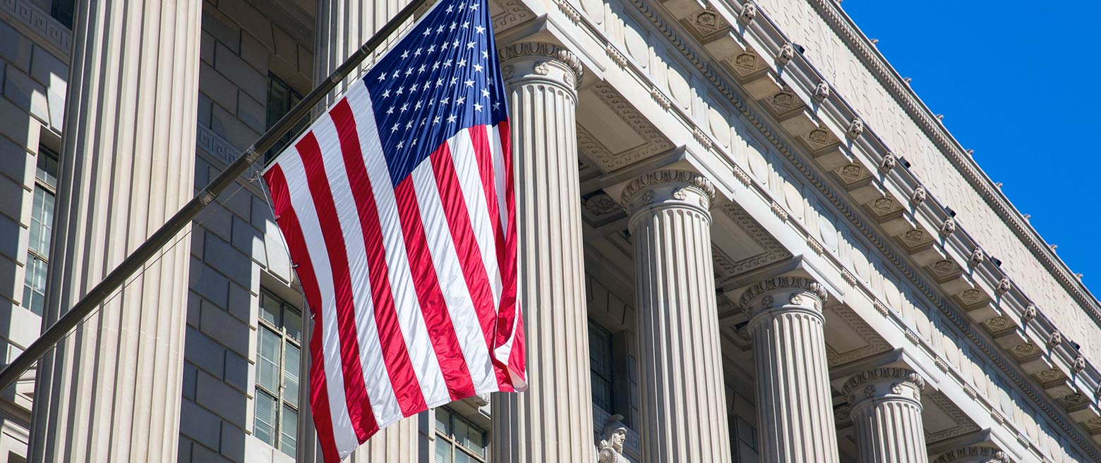 American flag hanging from federal building