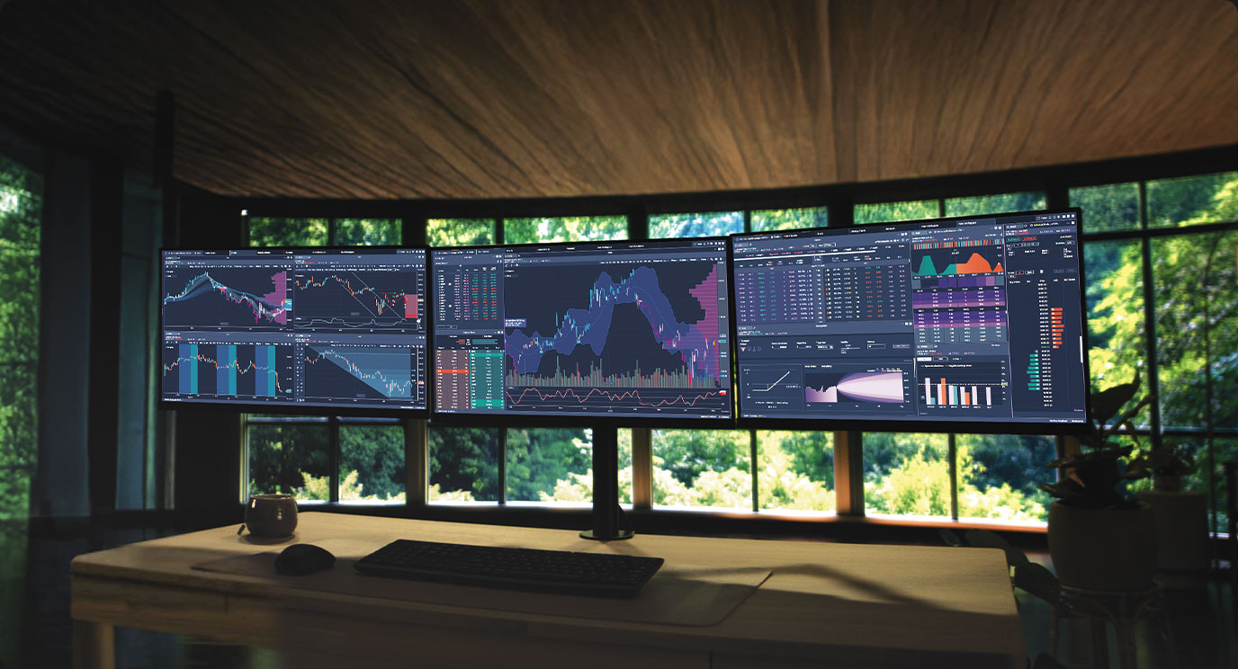 Power E*TRADE Pro desktop trading app platform on three trading monitors