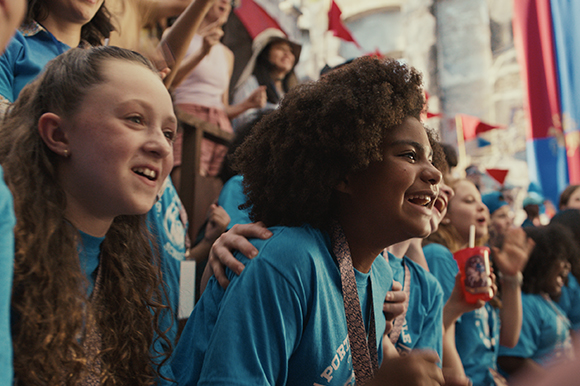 Kids smiling at a medieval duel