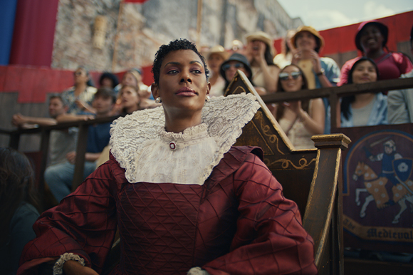 Woman in medieval attire looking to the right