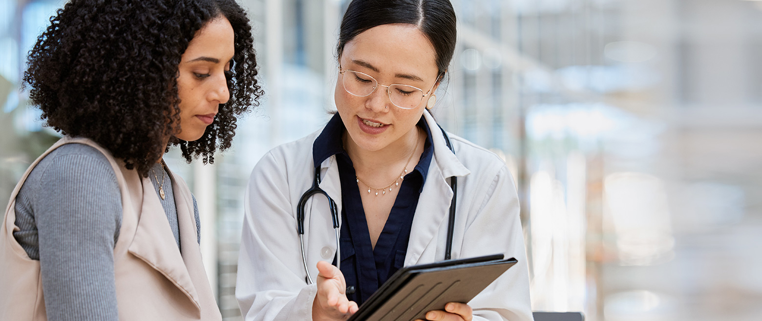 Doctor speaking to woman