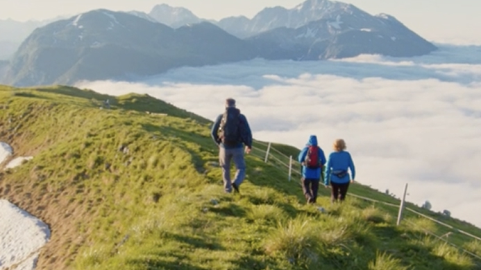 Family walking on a hill