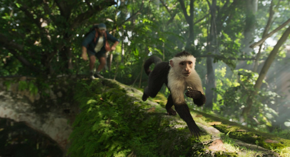 Man chasing after monkey with a ring from E*TRADE's new ad campaign
