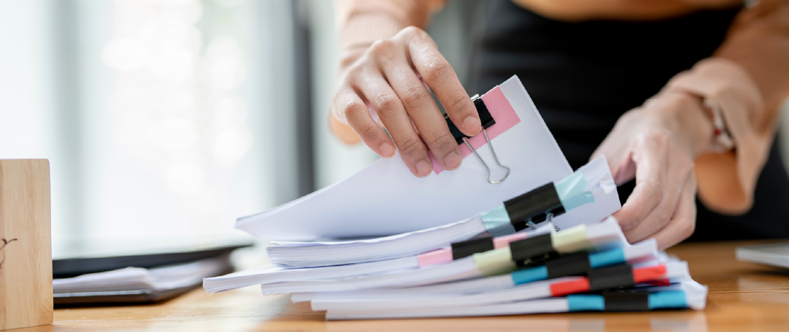 Image of person looking through paperwork