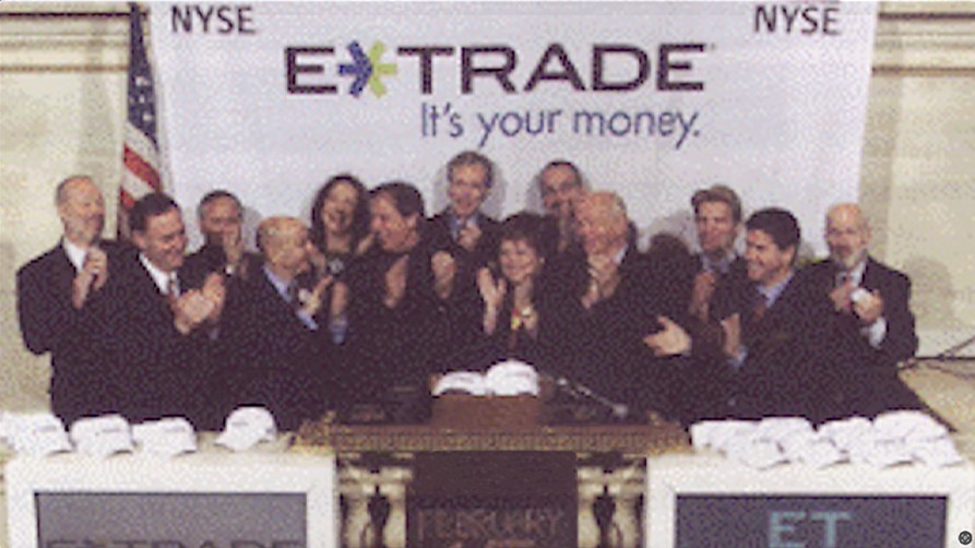 Historical photo showing E*TRADE employees at the New York Stock Exchange