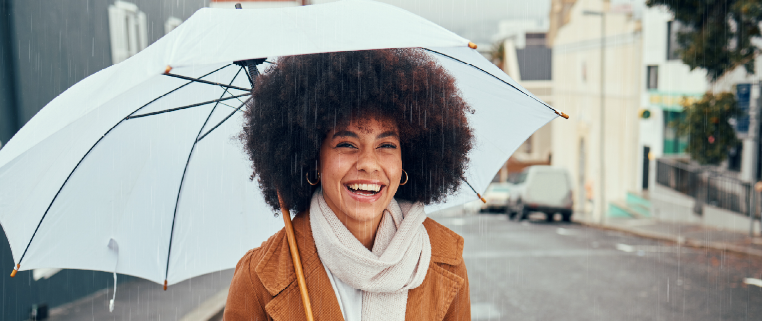 Woman standing under umbrella