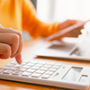 Person using a calculator for their taxes