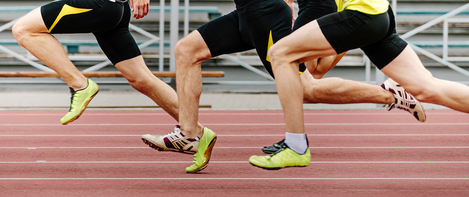 Close up of track stars running