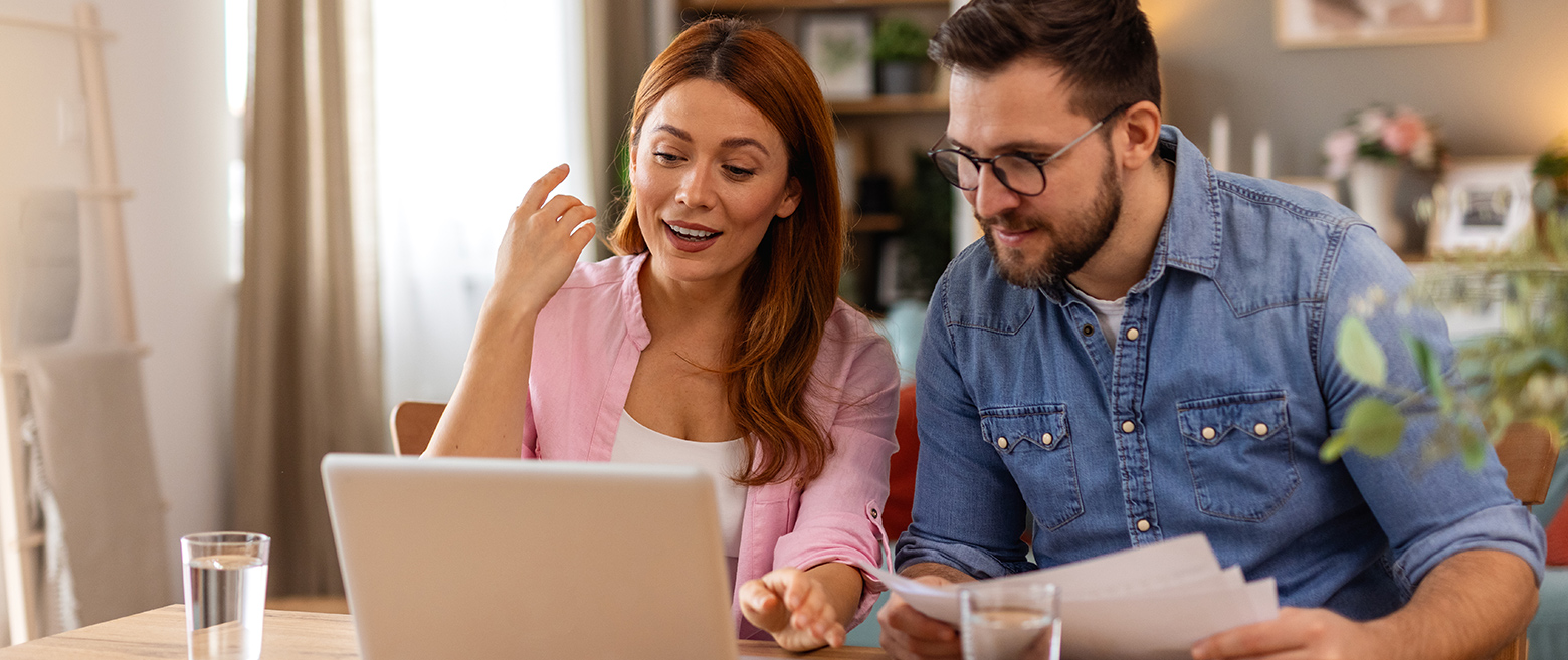 Couple working together on laptop