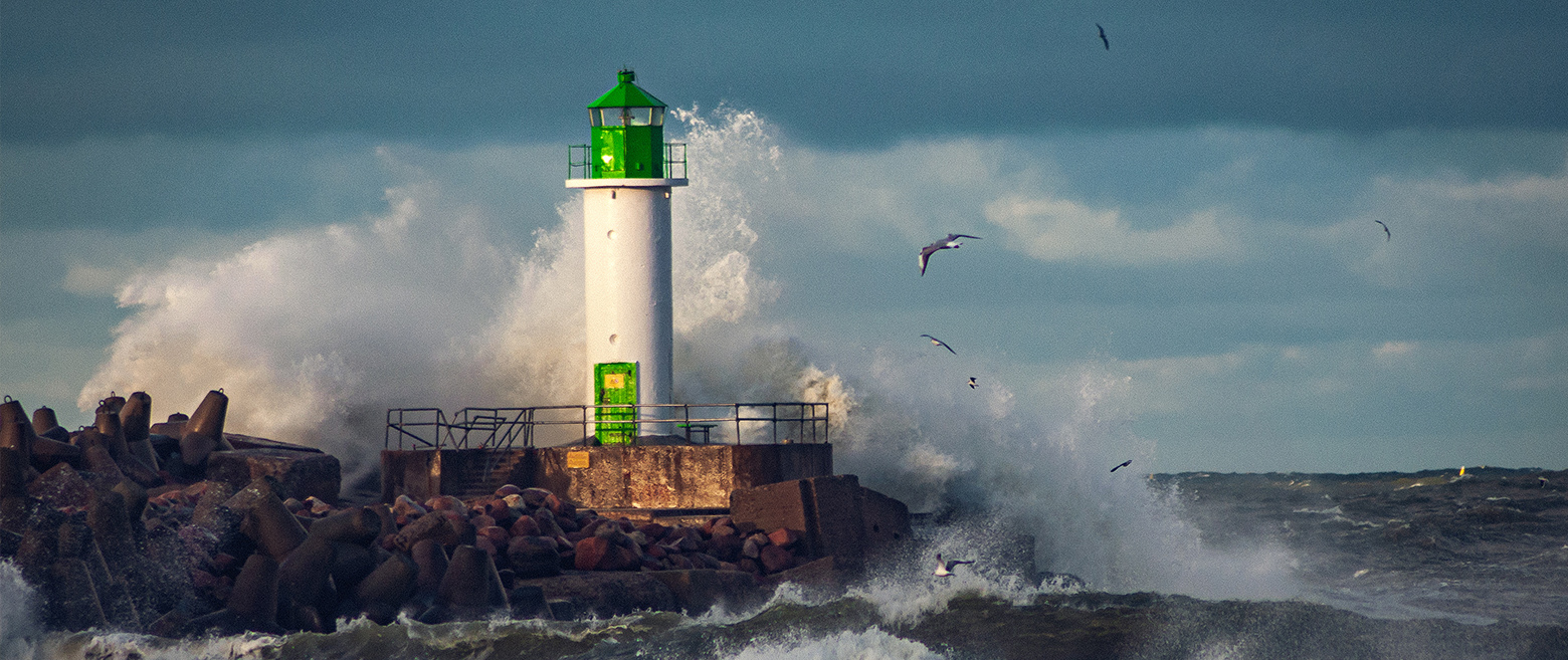 Light house with waves crashing on it