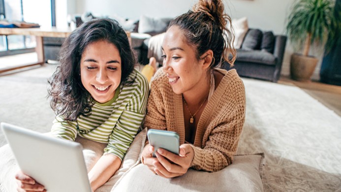 Two girls looking at ipad