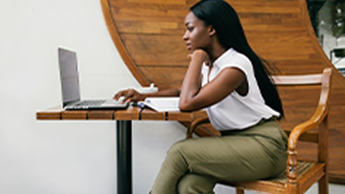 Woman typing on a computer