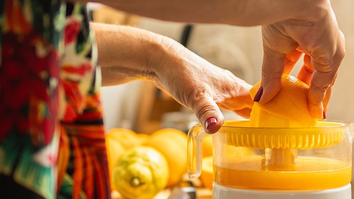 Woman squeezing lemons