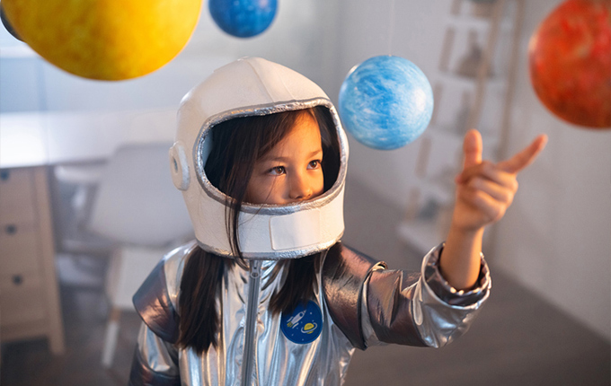 Young girl in a space suit