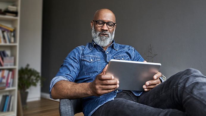 Man looking at iPad device