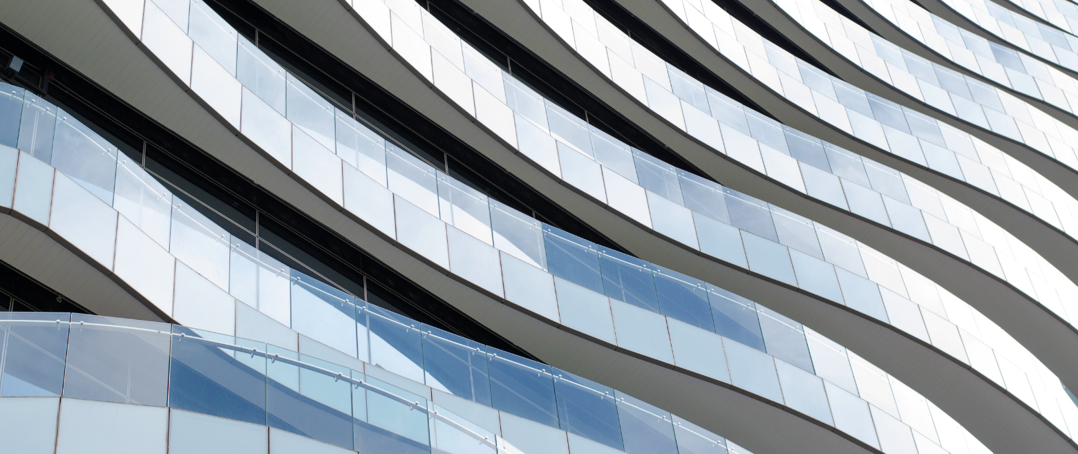 Curved glass facade of a modern building.