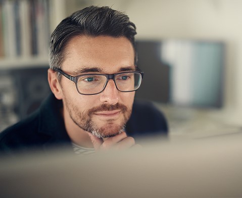 Man looking at computer screen