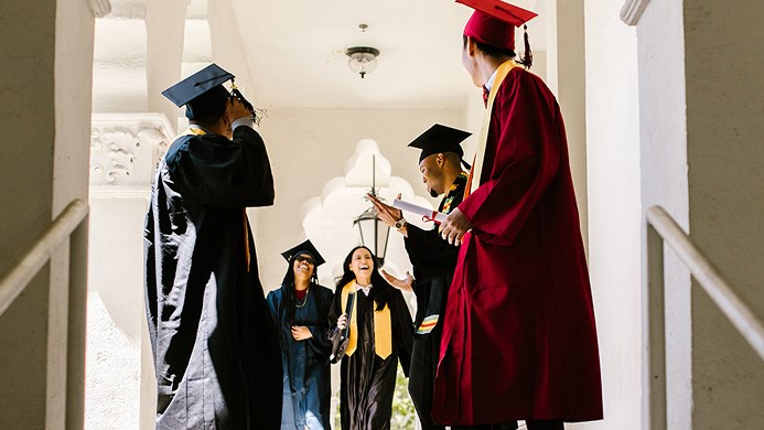 People in graduation gowns